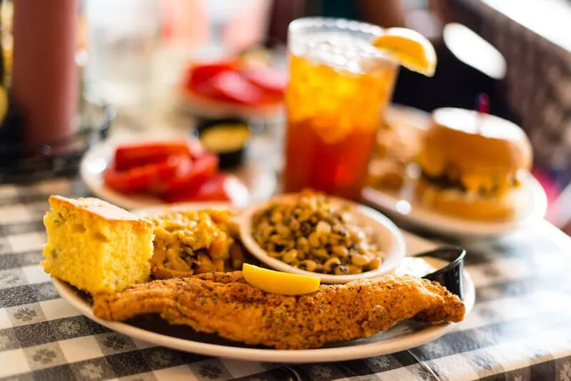 fried fish with cornbread and glass of tea