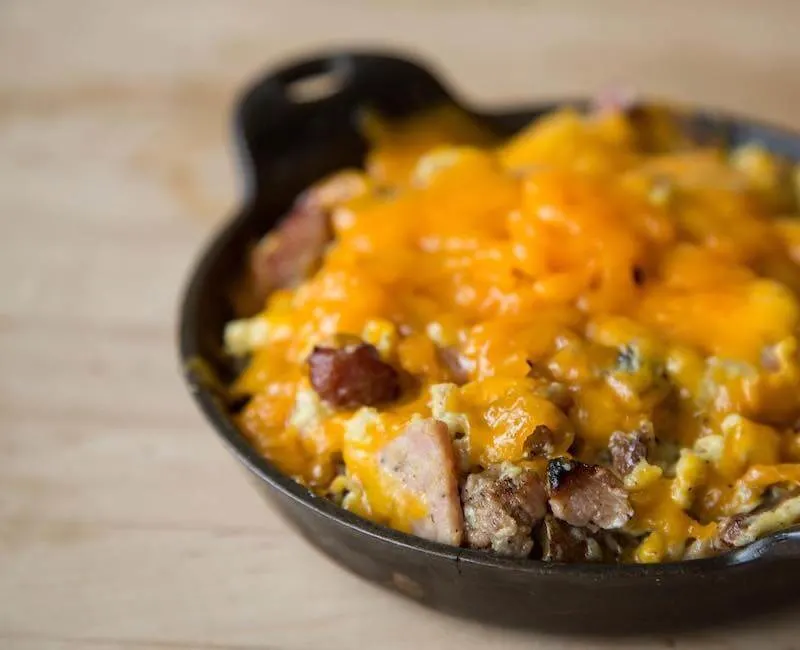 breakfast skillet topped with cheese