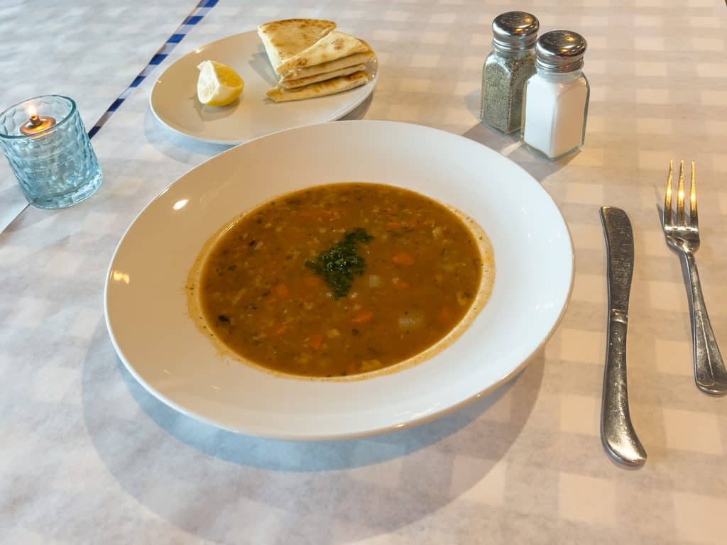 homemade black-eyed pea soup with freshly toasted pita bread