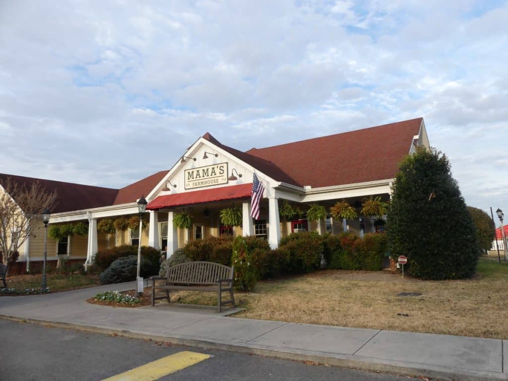 Mama's Farmhouse restaurant with a red roof and white exterior in a suburban setting.