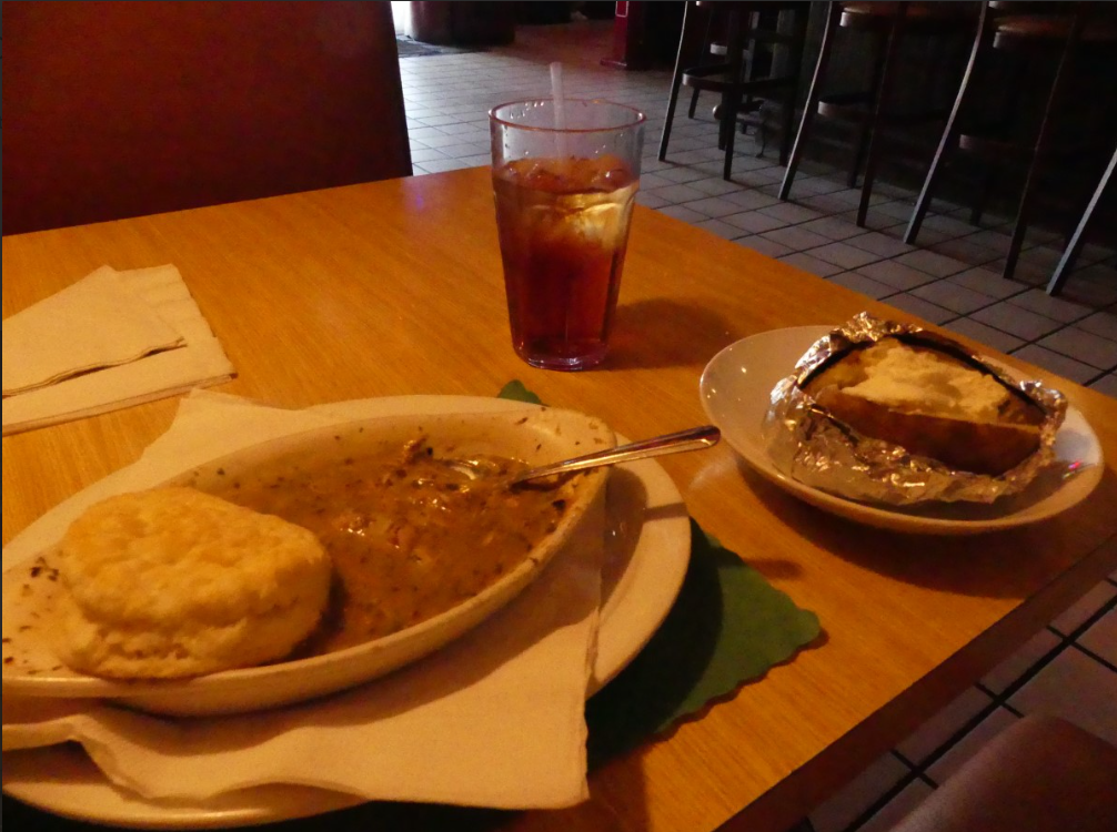 Chicken and dumplings and a side of a baked potato at Jeremiah's
