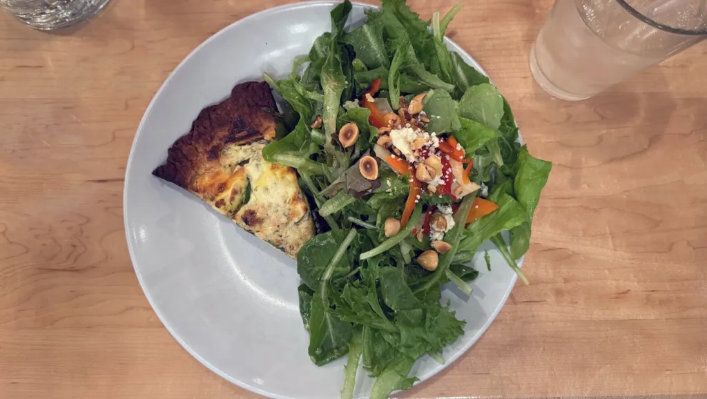 Asparagus, watercress, house ricotta and herbed quiche with a side salad at La Porte Rouge